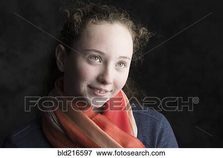 Stock Photo - Close up of Caucasian girl wearing scarf. Fotosearch