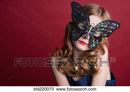 Close up of Caucasian girl wearing butterfly mask View Large Photo Image Stock Image - Close up of Caucasian girl wearing butterfly mask. Fotosearch