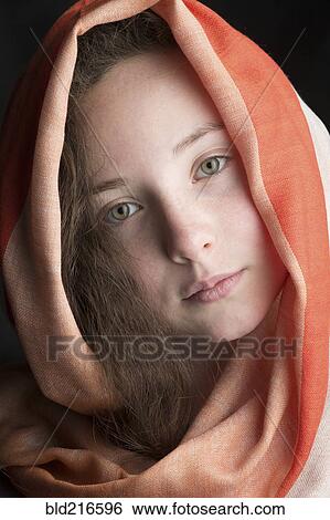 Stock Photograph - Close up of Caucasian girl wearing headscarf. Fotosearch