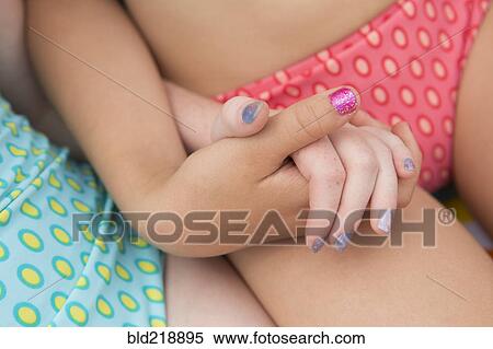 Close up of Caucasian girls holding hands View Large Photo Image Stock Photography - Close up of Caucasian girls holding hands. Fotosearch
