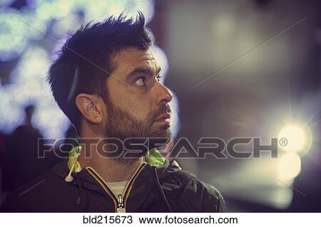 Stock Image - Close up of Caucasian man looking up. Fotosearch