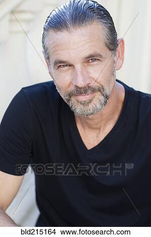 Picture - Close up of Caucasian man smiling outdoors. Fotosearch