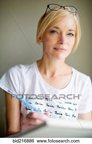 Close up of Caucasian woman drawing View Large Photo Image Stock Photograph - Close up of Caucasian woman drawing. Fotosearch