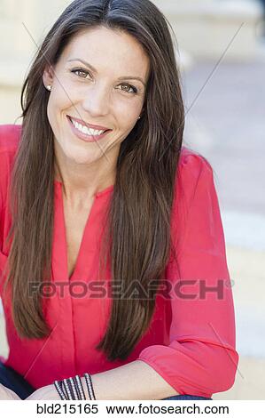 Stock Photography - Close up of Caucasian woman smiling outdoors. Fotosearch