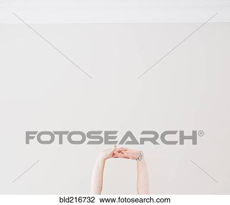 Close up of Caucasian woman stretching arms in midair View Large Photo Image Stock Image - Close up of Caucasian woman stretching arms in midair. Fotosearch