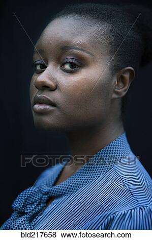 Stock Photo - Close up of confident Black woman. Fotosearch