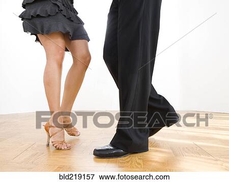 Stock Photo - Close up of couple dancing in studio. Fotosearch