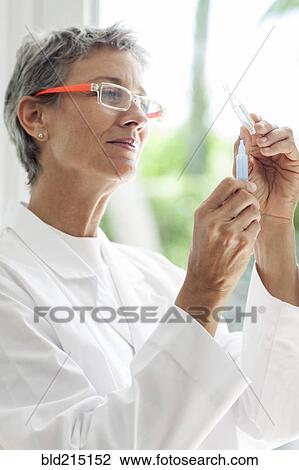 Close up of doctor drawing syringe shot View Large Photo Image Stock Image - Close up of doctor drawing syringe shot. Fotosearch