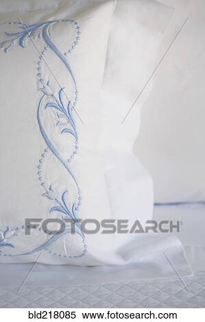 Stock Photography - Close up of embroidery on pillow. Fotosearch