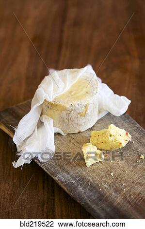 Close up of fresh cheese on cutting board View Large Photo Image Stock Image - Close up of fresh cheese on cutting board. Fotosearch