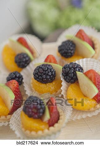 Picture - Close up of fresh fruit desserts. Fotosearch