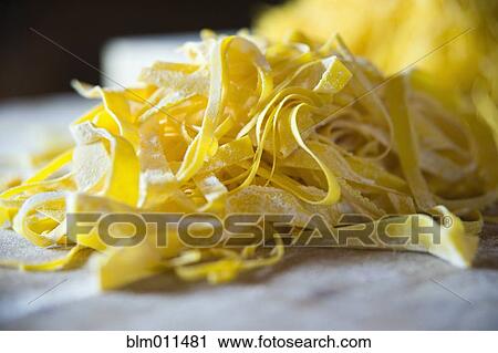 Stock Image - Close up of fresh pasta noodles. Fotosearch