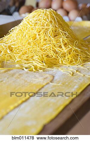 Stock Photo - Close up of fresh pasta noodles. Fotosearch