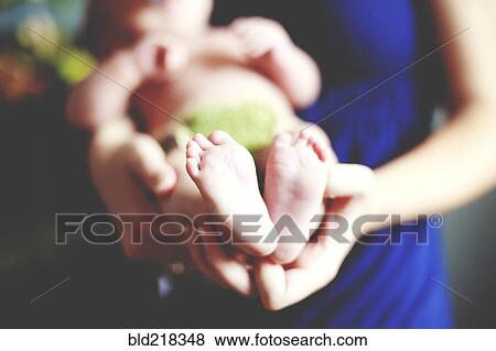 Close up of girl holding baby View Large Photo Image Stock Photo - Close up of girl holding baby. Fotosearch
