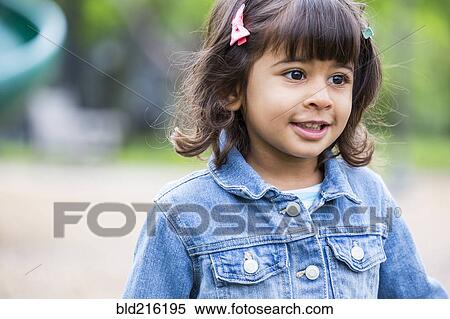 Stock Photography - Close up of girl walking at playground. Fotosearch