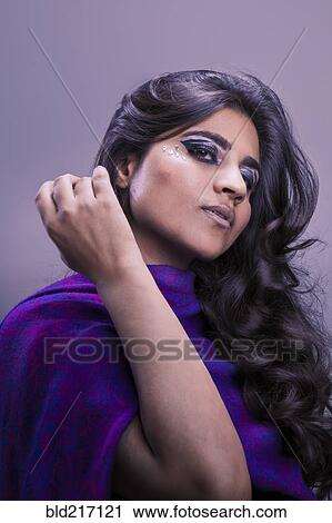 Stock Image - Close up of glamorous serious Pakistani woman. Fotosearch