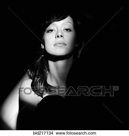 Picture - Close up of glamorous woman in spotlight. Fotosearch