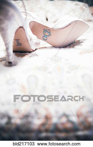Stock Image - Close up of high heels for bride. Fotosearch