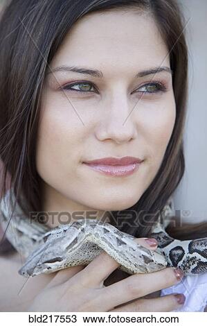 Close up of Hispanic woman with snake around her neck View Large Photo Image Stock Image - Close up of Hispanic woman with snake around her neck. Fotosearch