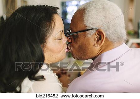 Stock Image - Close up of kissing couple. Fotosearch
