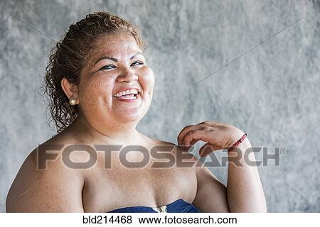 Stock Photo - Close up of laughing Hispanic woman. Fotosearch
