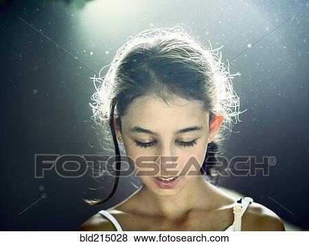 Close up of mixed race girl looking down View Large Photo Image Stock Photo - Close up of mixed race girl looking down. Fotosearch