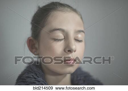 Close up of mixed race girl with eyes closed View Large Photo Image Stock Photo - Close up of mixed race girl with eyes closed. Fotosearch