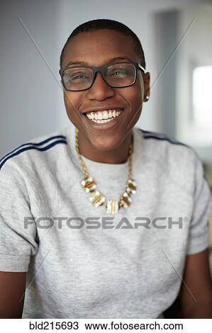 Stock Image - Close up of mixed race woman smiling. Fotosearch