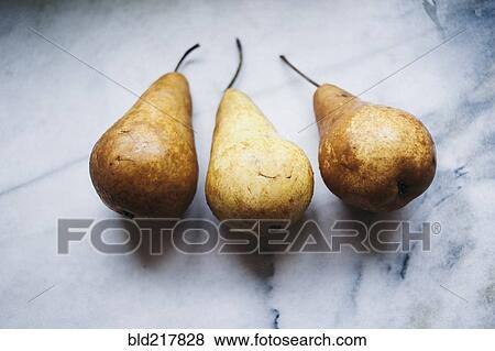 Stock Photo - Close up of pears on marble counter. Fotosearch