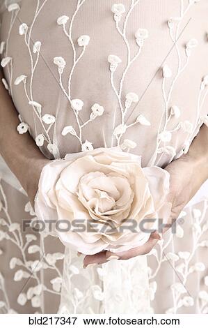 Close up of pregnant bride carrying bouquet View Large Photo Image Stock Photo - Close up of pregnant bride carrying bouquet. Fotosearch
