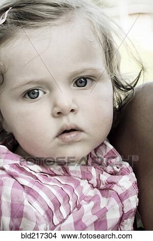 Close up of serious Caucasian baby girl View Large Photo Image Picture - Close up of serious Caucasian baby girl. Fotosearch