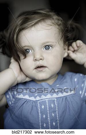 Close up of serious Caucasian baby girl View Large Photo Image Stock Image - Close up of serious Caucasian baby girl. Fotosearch