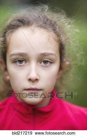 Stock Photo - Close up of serious Caucasian girl. Fotosearch