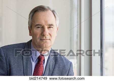 Stock Photo - Close up of serious Caucasian businessman. Fotosearch