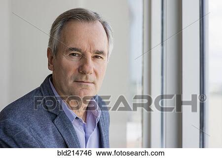 Close up of serious Caucasian businessman View Large Photo Image Stock Photograph - Close up of serious Caucasian businessman. Fotosearch