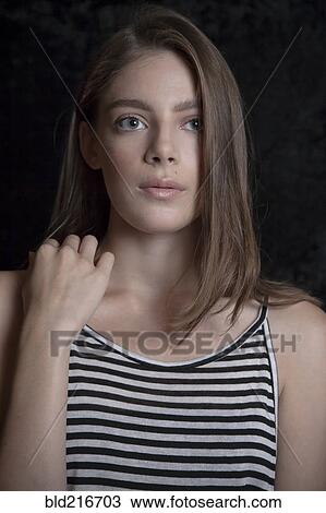 Stock Image - Close up of serious Caucasian woman. Fotosearch