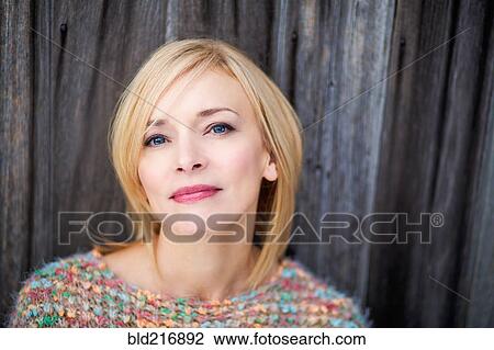 Stock Image - Close up of serious Caucasian woman. Fotosearch