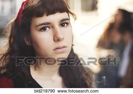 Stock Image - Close up of serious Caucasian woman. Fotosearch