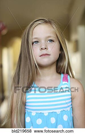 Stock Photo - Close up of serious girl with long hair. Fotosearch
