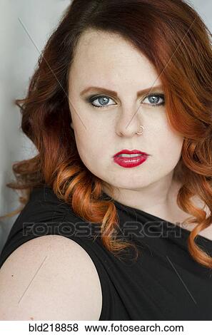 Close up of serious glamorous woman View Large Photo Image Stock Photo - Close up of serious glamorous woman. Fotosearch