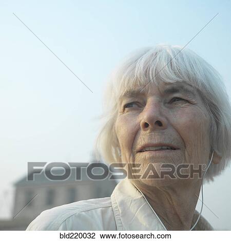 Stock Image - Close up of serious older woman. Fotosearch