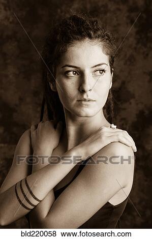 Stock Photo - Close up of serious woman with dreadlocks. Fotosearch