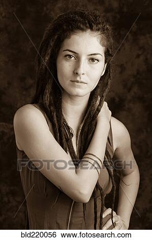 Stock Photograph - Close up of serious woman with dreadlocks. Fotosearch