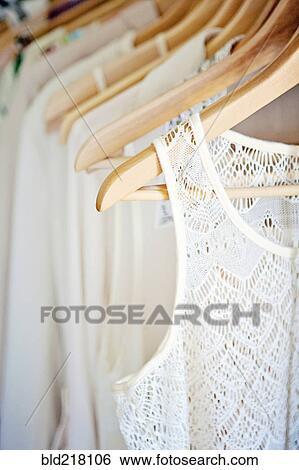 Close up of shirts on hangers View Large Photo Image Stock Photograph - Close up of shirts on hangers. Fotosearch