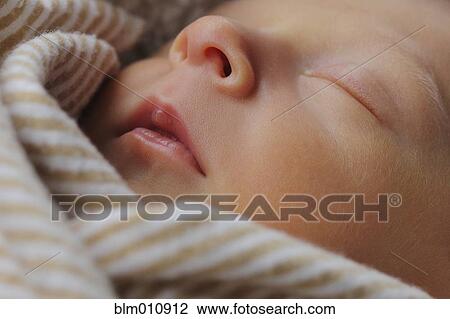 Stock Image - Close up of sleeping baby boy. Fotosearch