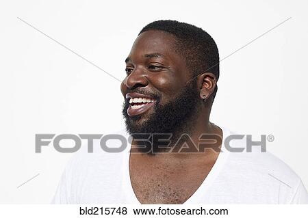 Stock Photo - Close up of smiling Black man with beard. Fotosearch