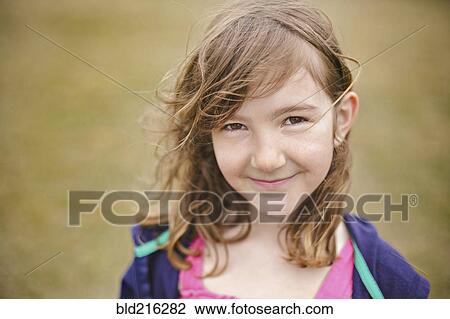 Stock Image - Close up of smiling Caucasian girl. Fotosearch