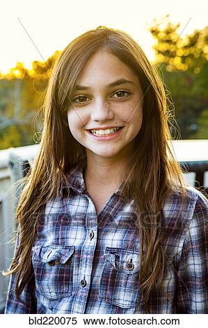 Stock Photography - Close up of smiling Caucasian teenage girl. Fotosearch