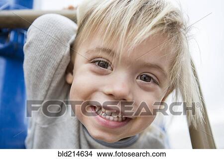 Close up of smiling face of Hispanic boy View Large Photo Image Picture - Close up of smiling face of Hispanic boy. Fotosearch