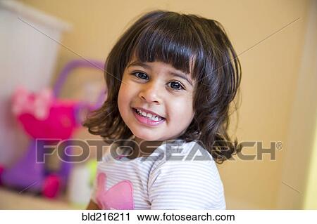 Stock Image - Close up of smiling girl. Fotosearch